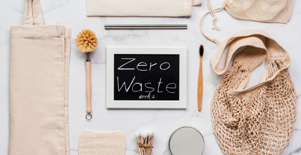 Chalk board reading "Zero Waste Week 2", surrounded with zero waste products