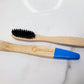 Eco Shark's bamboo toothbrush with soft charcoal bristles in a W shape