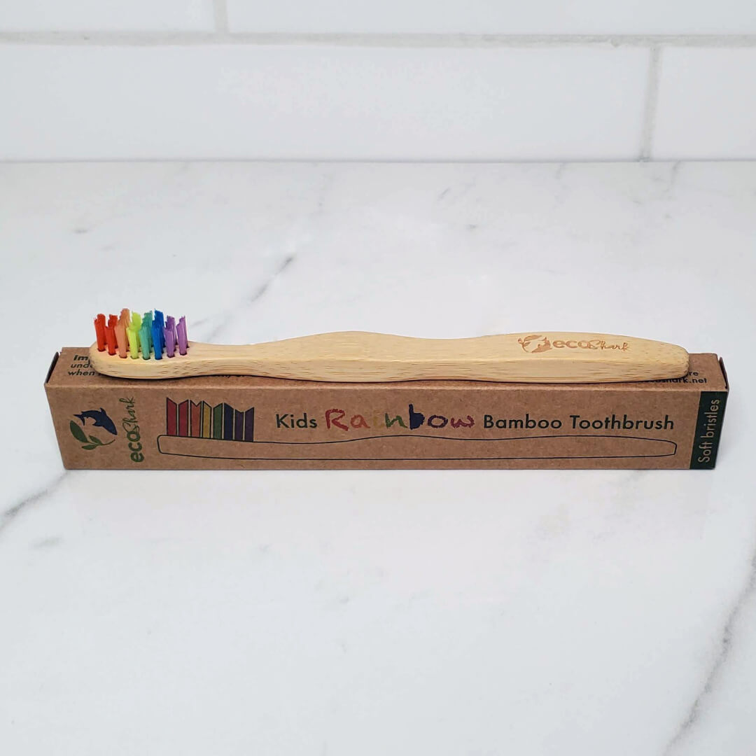 Bamboo kids toothbrush in rainbow with minimal packaging